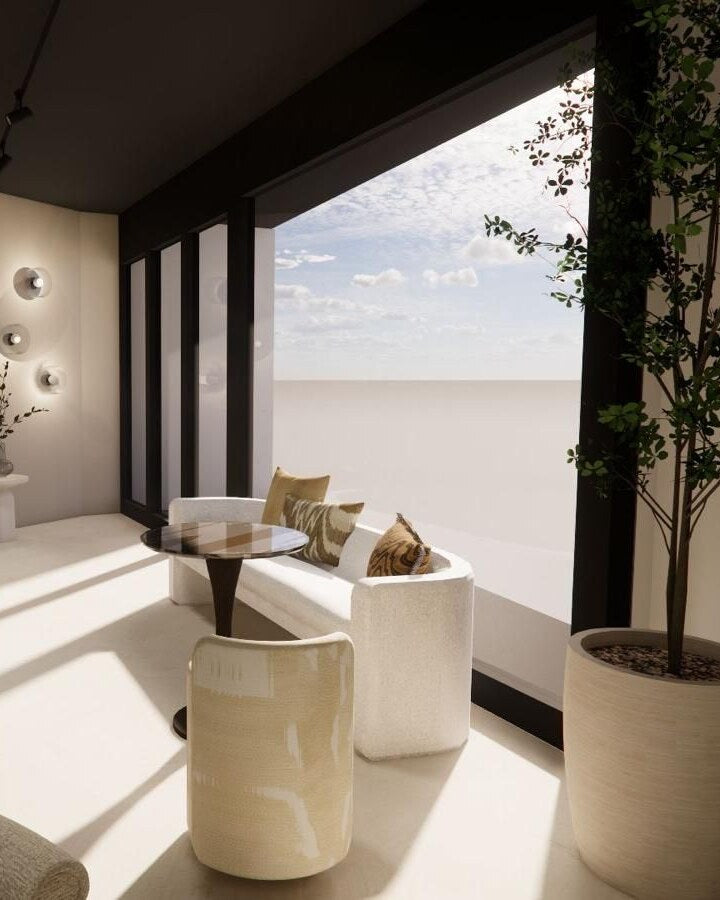 Impressie van de zithoek in de nieuwe MODI salon: daglicht, een olijfboom en zachte fauteuils