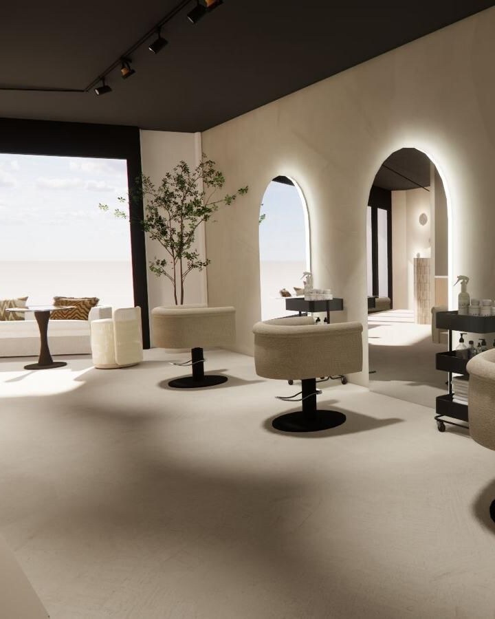 Impressie van de nieuwe MODI salon bij daglicht: de zithoek en de verlichte werkplekken